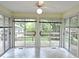 Sunroom featuring multiple sliding glass doors and neutral tile flooring at 122 E Orange St, Hillsborough, NC 27278