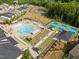 Overhead view of community amenities featuring pool, bocce ball, and tennis courts at 140 Azure Mist Dr, Raleigh, NC 27610