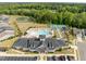 Aerial view of community clubhouse featuring pool, tennis courts, and other amenities at 140 Azure Mist Dr, Raleigh, NC 27610