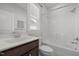 Bathroom with a vanity sink, a bathtub shower combo, and a window for natural light at 140 Azure Mist Dr, Raleigh, NC 27610