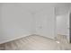 Empty bedroom with carpet flooring and neutral walls with entry doorway at 140 Azure Mist Dr, Raleigh, NC 27610