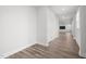 Inviting hallway with wood-look floors leads to an open floorplan at 140 Azure Mist Dr, Raleigh, NC 27610
