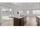 Stylish kitchen island perfect for entertaining and connecting to outdoor living at 140 Azure Mist Dr, Raleigh, NC 27610