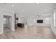 Bright and airy living room featuring modern flooring and recessed lighting at 140 Azure Mist Dr, Raleigh, NC 27610