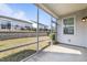 Screened patio with views of back yard and neighboring homes at 140 Azure Mist Dr, Raleigh, NC 27610