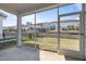 Relaxing screened porch with view of well-maintained backyard and neighboring homes at 140 Azure Mist Dr, Raleigh, NC 27610