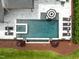 Aerial view of a pool with tanning deck, spa, and meticulously landscaped backyard at 1416 Bailey Hill Dr, Raleigh, NC 27614