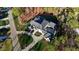 Breathtaking aerial shot of an estate home with perfectly manicured lawn surrounded by mature trees at 1416 Bailey Hill Dr, Raleigh, NC 27614