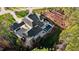 Aerial view showcases a luxury home with a pool and outdoor entertaining area at 1416 Bailey Hill Dr, Raleigh, NC 27614
