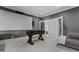 Finished basement with foosball table, home theater setup, and open layout at 1416 Bailey Hill Dr, Raleigh, NC 27614