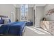 Bright bedroom with a large window, comfortable seating, and neutral tones at 1416 Bailey Hill Dr, Raleigh, NC 27614