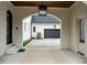 Arched porte-cochere providing covered access to the home and a view of the garage at 1416 Bailey Hill Dr, Raleigh, NC 27614