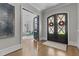 Grand foyer with hardwood floors, open to living area with elegant chandelier at 1416 Bailey Hill Dr, Raleigh, NC 27614