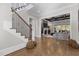 Open foyer with staircase, leading to a living room with a fireplace at 1416 Bailey Hill Dr, Raleigh, NC 27614