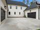 Spacious motor court and three-car garage offer ample parking for vehicles and storage at 1416 Bailey Hill Dr, Raleigh, NC 27614