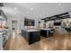 Modern kitchen with two islands, stainless appliances, and open view to the living room at 1416 Bailey Hill Dr, Raleigh, NC 27614