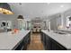 Spacious open kitchen with two islands, sink, eat in dining area, and stone fireplace at 1416 Bailey Hill Dr, Raleigh, NC 27614