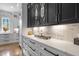 Kitchen counter with marble countertop, cabinets with black pulls, and white marble backsplash at 1416 Bailey Hill Dr, Raleigh, NC 27614
