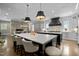 Open concept kitchen with dual islands, eat in dining, stainless appliances, and stone fireplace at 1416 Bailey Hill Dr, Raleigh, NC 27614