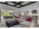 Spacious living room with coffered ceiling, fireplace, and access to outdoor patio at 1416 Bailey Hill Dr, Raleigh, NC 27614