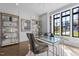 Bright office with large windows, stylish desk, and custom shelving at 1416 Bailey Hill Dr, Raleigh, NC 27614