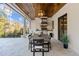 Covered patio with outdoor dining area and built-in stainless steel grill at 1416 Bailey Hill Dr, Raleigh, NC 27614