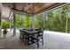 Elegant outdoor dining area with table, chairs, and a view of the pool at 1416 Bailey Hill Dr, Raleigh, NC 27614