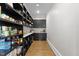 Spacious walk-in pantry with ample shelving, storage cabinets, and well-organized layout at 1416 Bailey Hill Dr, Raleigh, NC 27614