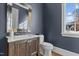 Chic powder room featuring a vanity with marble countertop, modern fixtures, and elegant wall texture at 1416 Bailey Hill Dr, Raleigh, NC 27614