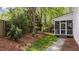 Backyard featuring stone path and view of the screened porch at 1416 Heritage Links Dr, Wake Forest, NC 27587