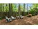 Secluded backyard seating area with comfortable Adirondack chairs and peaceful wooded views at 1416 Heritage Links Dr, Wake Forest, NC 27587