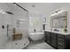 Bright bathroom showcases a glass shower, standalone tub, and a stylish vanity at 1416 Heritage Links Dr, Wake Forest, NC 27587