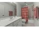 Clean bathroom with a vanity, toilet, and shower/tub combination with a light-colored tile at 1416 Heritage Links Dr, Wake Forest, NC 27587