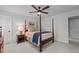 Bright bedroom featuring a four-poster bed, ceiling fan, and a tranquil, light-filled space at 1416 Heritage Links Dr, Wake Forest, NC 27587