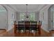 Bright dining room with wooden table and chairs set on hardwood flooring at 1416 Heritage Links Dr, Wake Forest, NC 27587