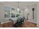 Charming dining area with natural light, wood floors, and views to the backyard at 1416 Heritage Links Dr, Wake Forest, NC 27587