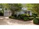 Charming home exterior featuring a two-car garage, lush landscaping, and inviting front porch at 1416 Heritage Links Dr, Wake Forest, NC 27587