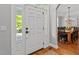 Bright foyer featuring hardwood floors and a view into the dining room, perfect for gatherings at 1416 Heritage Links Dr, Wake Forest, NC 27587
