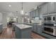 Stylish eat-in kitchen features an island, stainless appliances and tile backsplash at 1416 Heritage Links Dr, Wake Forest, NC 27587