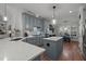 Open concept kitchen featuring an island, and stainless appliances, flowing to the dining area at 1416 Heritage Links Dr, Wake Forest, NC 27587