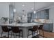 Bright kitchen featuring an island with bar seating, stainless appliances, and wooden floors at 1416 Heritage Links Dr, Wake Forest, NC 27587