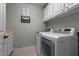 Laundry room featuring modern washer and dryer and white cabinets at 1416 Heritage Links Dr, Wake Forest, NC 27587