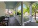 Relaxing covered porch featuring classic columns, a swing, and views of the lush surroundings at 1416 Heritage Links Dr, Wake Forest, NC 27587