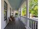 Spacious covered porch with classic columns, perfect for outdoor dining and relaxing with a view at 1416 Heritage Links Dr, Wake Forest, NC 27587