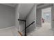 Neutral staircase with white carpet, gray walls, and a view of another room at 1416 Heritage Links Dr, Wake Forest, NC 27587