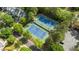 Aerial view of community tennis courts surrounded by mature shade trees at 1416 Heritage Links Dr, Wake Forest, NC 27587
