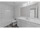 Stylish bathroom with combined tub and shower and bright vanity at 145 Gladstone Loop, Clayton, NC 27520