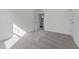 Bright bedroom with new carpet and an open door to the bathroom at 145 Gladstone Loop, Clayton, NC 27520