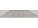 Close up shot of light gray carpet between a wall at 145 Gladstone Loop, Clayton, NC 27520