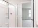 Bathroom with glass enclosed shower and doorway to the bedroom at 147 Little Crk Dr, Lillington, NC 27546
